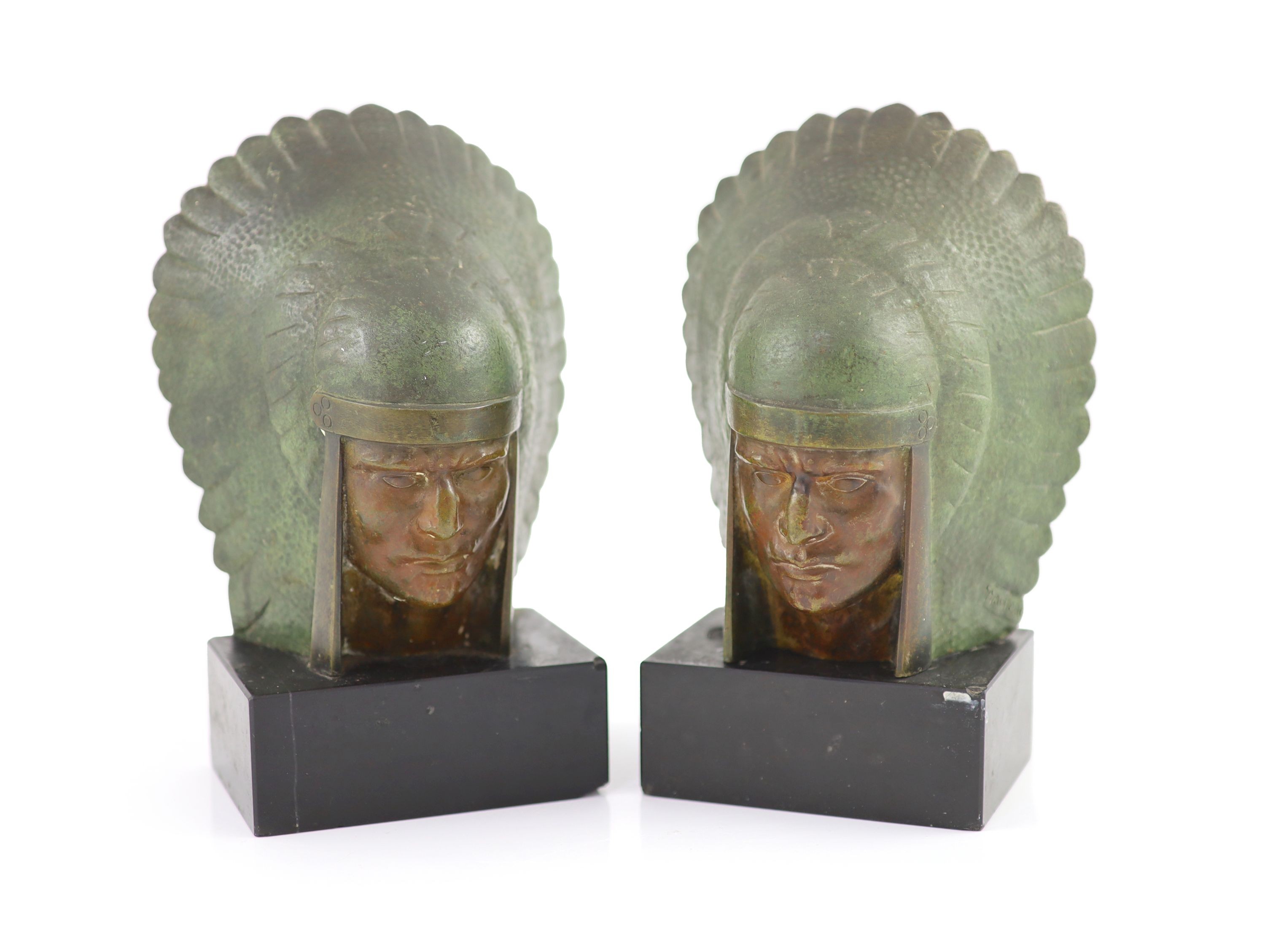 G.Garrett. A pair of Art Deco bronze bookends modelled as American Indian chiefs heads H 19cm. W 12.5cm.